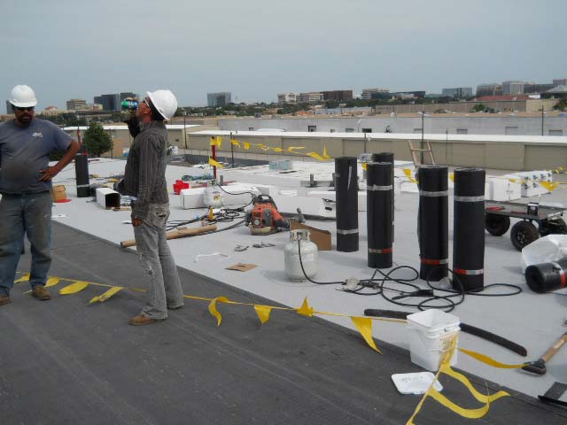 Modified Bitumen Roof being Installed - Nelson Roofing Company