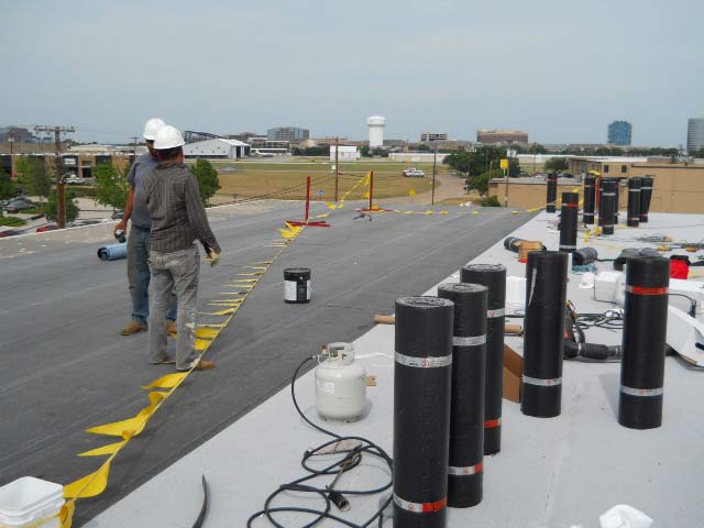 Modified Bitumen Roof being Installed - Nelson Roofing Company